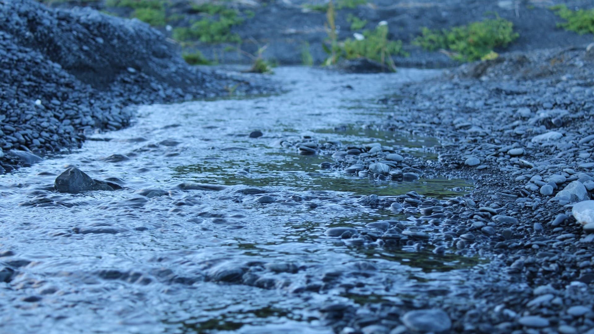 Creek running down a mountain with many rocks